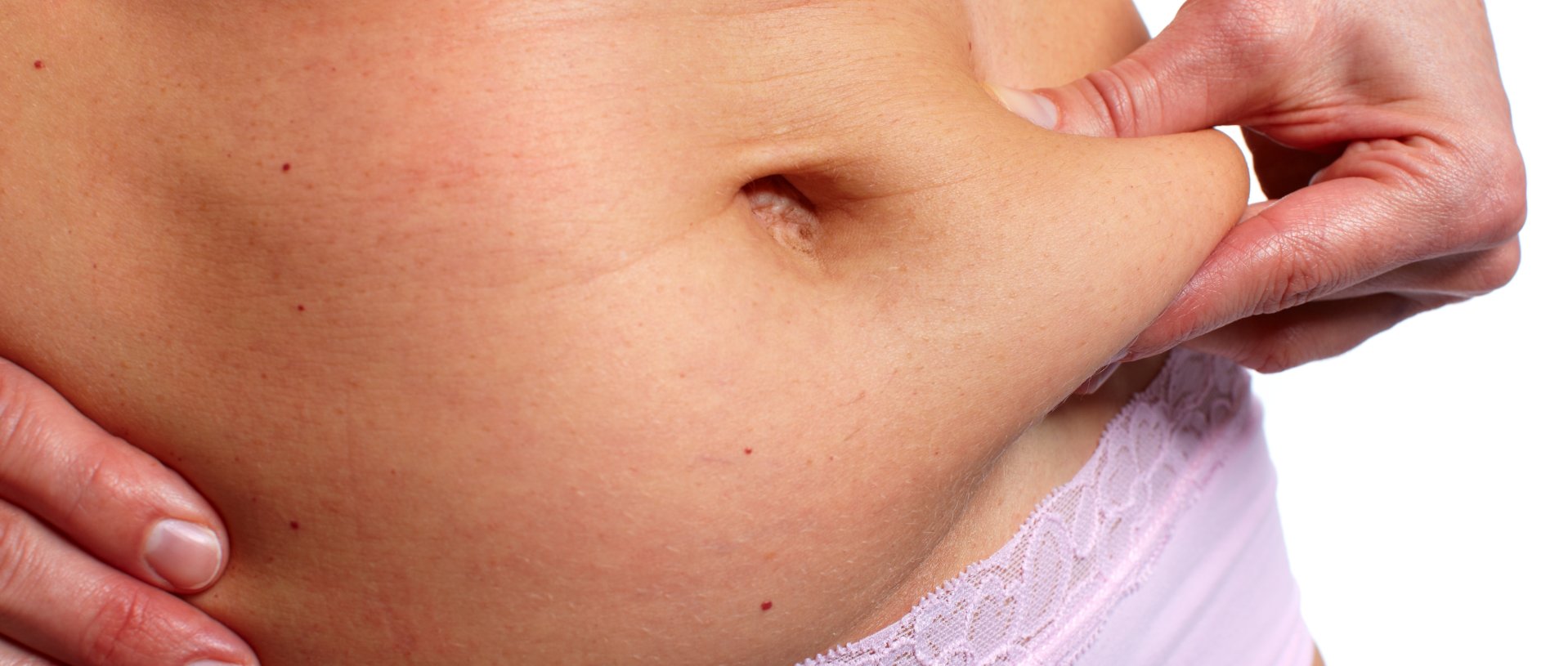 woman touches the skin on her belly