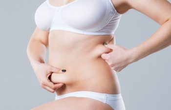 woman touching her abdomen