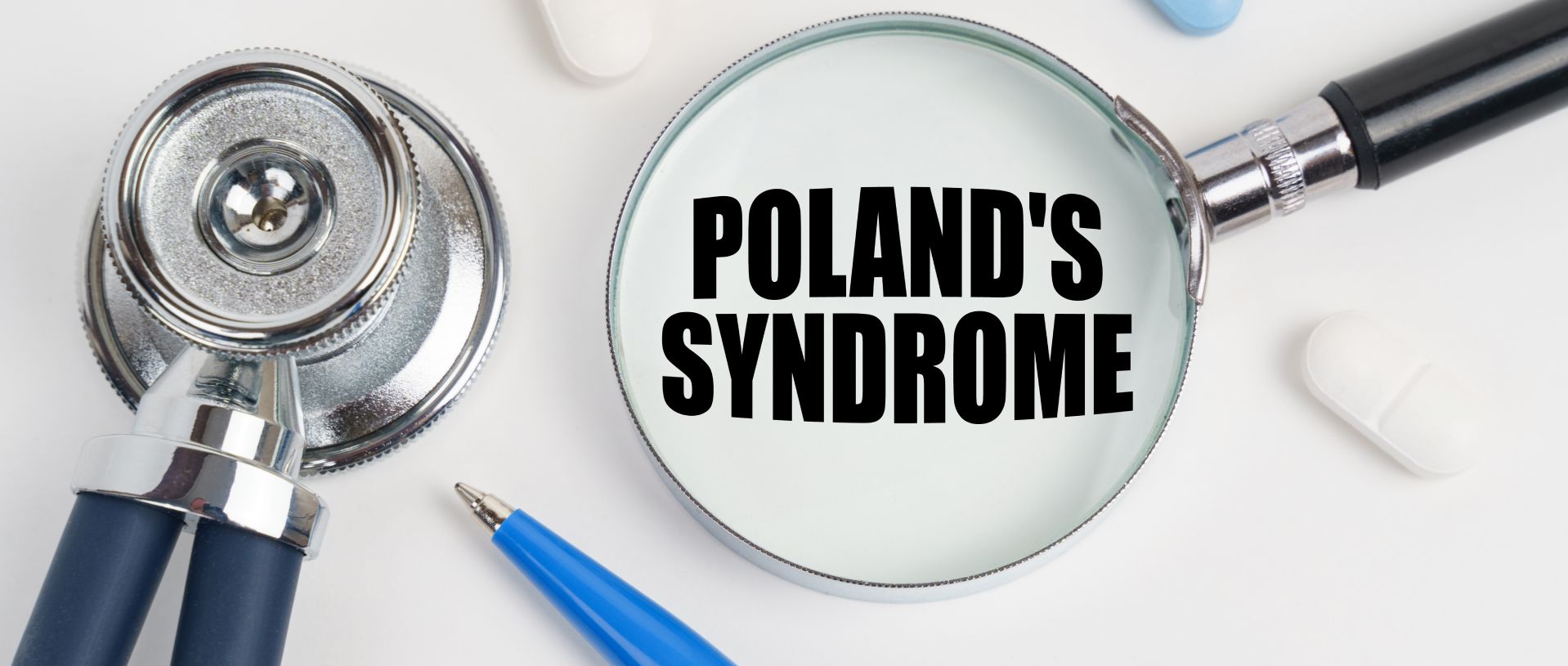 on a white surface lie pills, a pen, a stethoscope and a magnifying glass with the inscription - Poland's syndrome