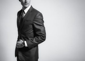 A slim man wearing a suit.