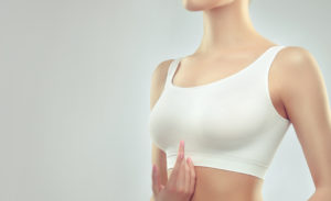 A woman wearing white sports bra.
