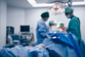 Blurred Photo of Plastic Surgeons in Surgical Room