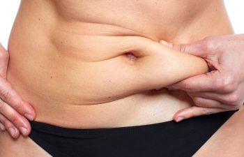 woman touching her belly