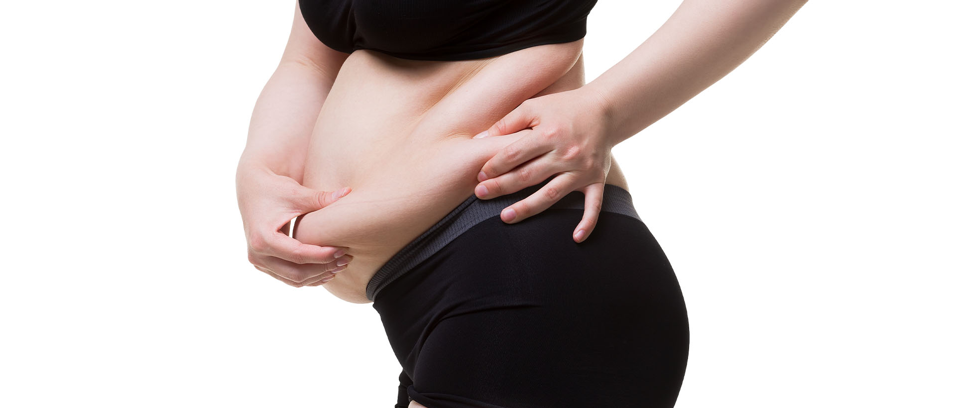 woman holding her flabby skin on a fat belly